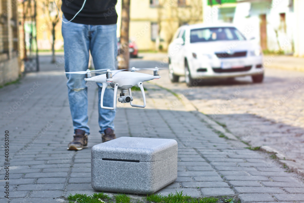 Quadroopter pilot manages it by radio. Man, guy Beautiful drone for photos and videos and clearance for his flights. Photo for your design. Quadroopter pilot manages it by radio. Man, guy Beautiful drone for photos and videos and clearance for his flights. Photo for your design.