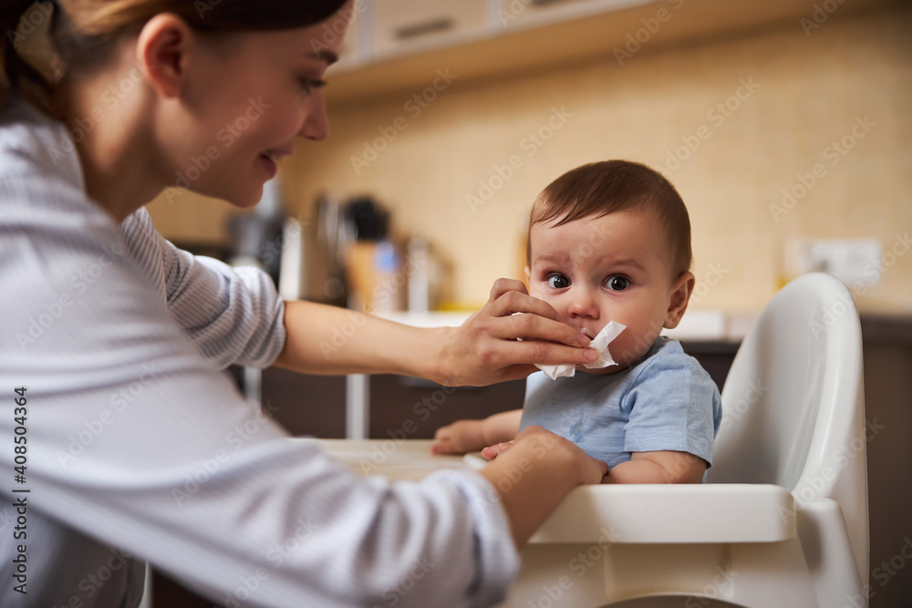 Cute Babyboy having his dinner with mom Cute Babyboy having his dinner with mom