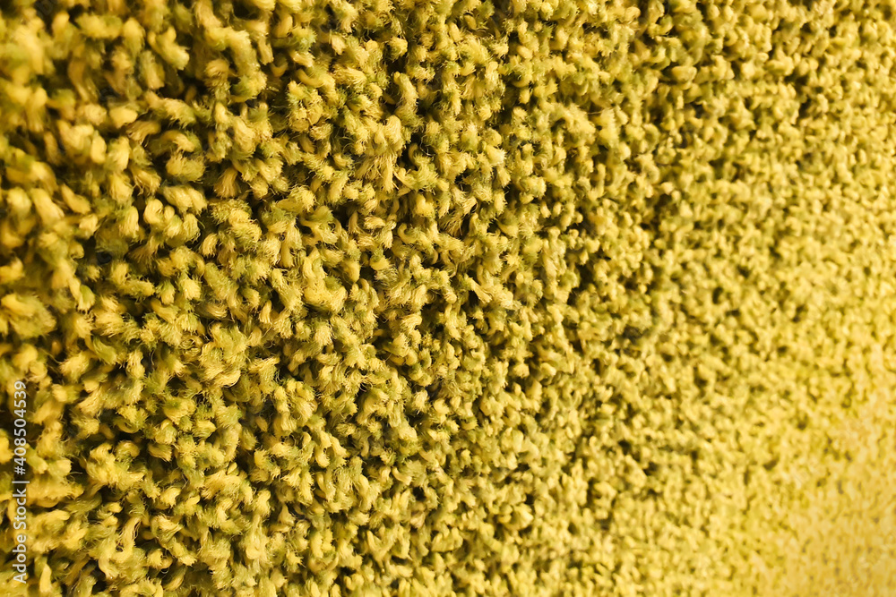 Green carpet roll covering. Polypropylene long pile carpet texture. Green carpet roll covering. Polypropylene long pile carpet texture.