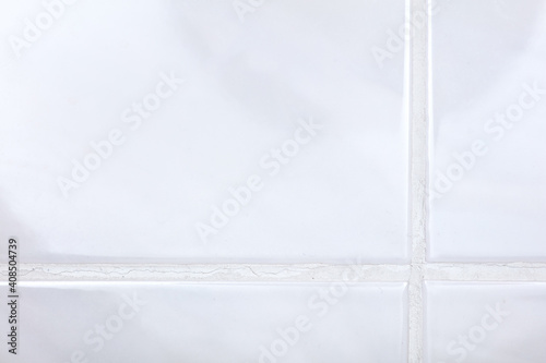 defects and disadvantages of poor-quality grouting of ceramic tile joints. Cracks, spots, darkening, yellowness of cement lime grout of tile joints