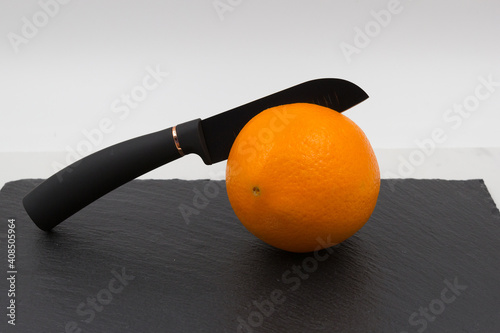 A knife in an orange