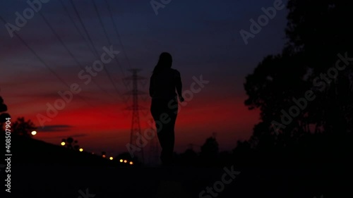 silhouette woman running slow motion
