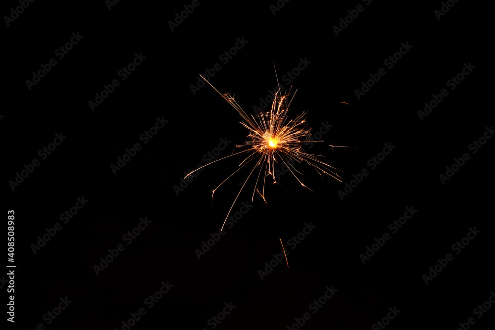 sparklers, bengal fire burns on a black background