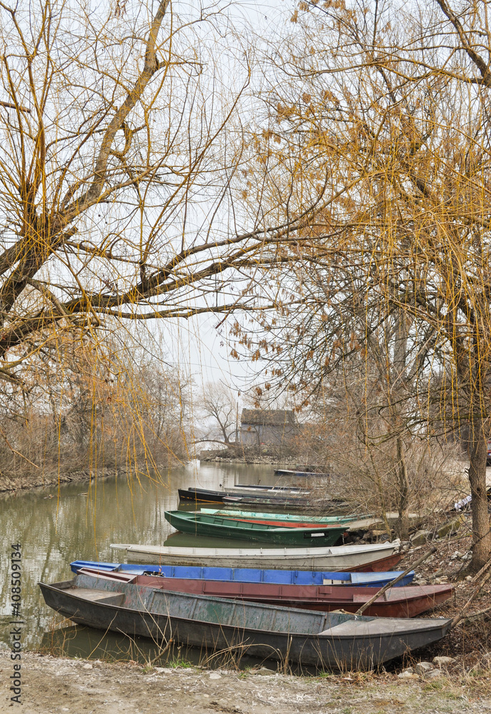 Boats on the river. Vibrant Autumn colors. Creative composition in nature.