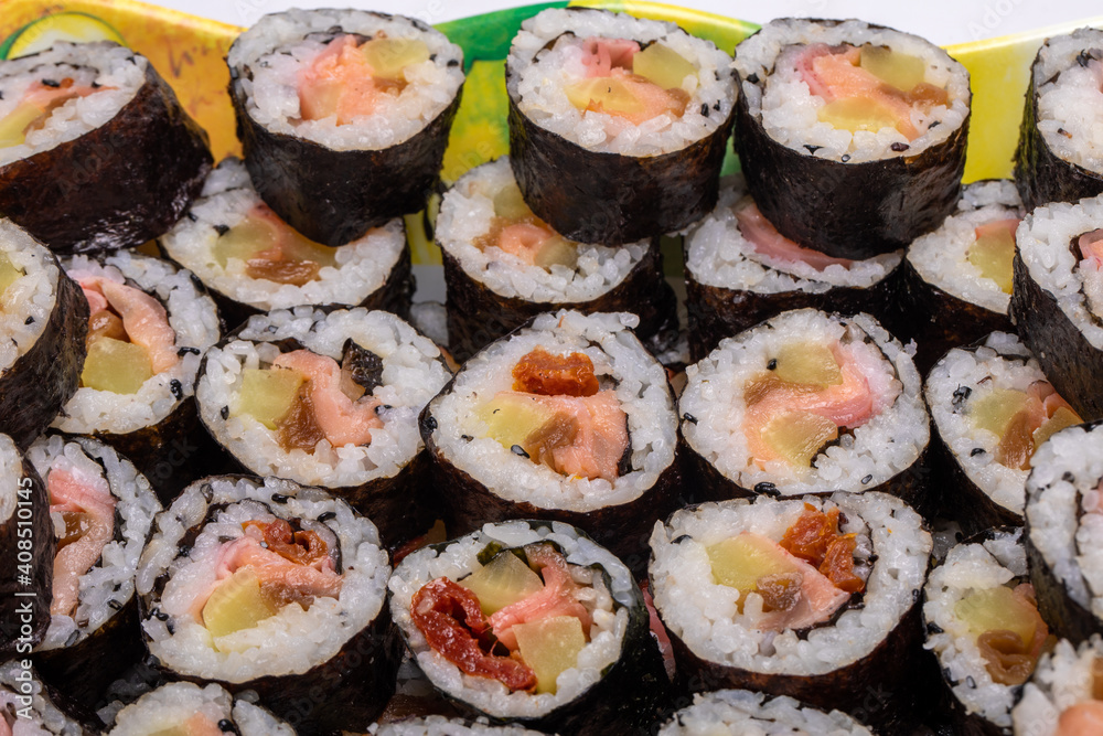 Top view of stack of Japanese sushi maki roll plate. Served in Japanese bar restaurant with chopstick Top view of stack of Japanese sushi maki roll plate. Served in Japanese bar restaurant with chopstick