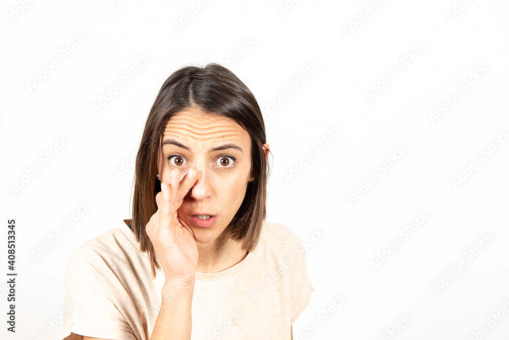 A serious latin woman telling a secret. A serious latin woman telling a secret.