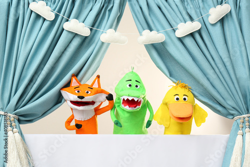 Obraz na plátně Creative puppet show on white stage indoors