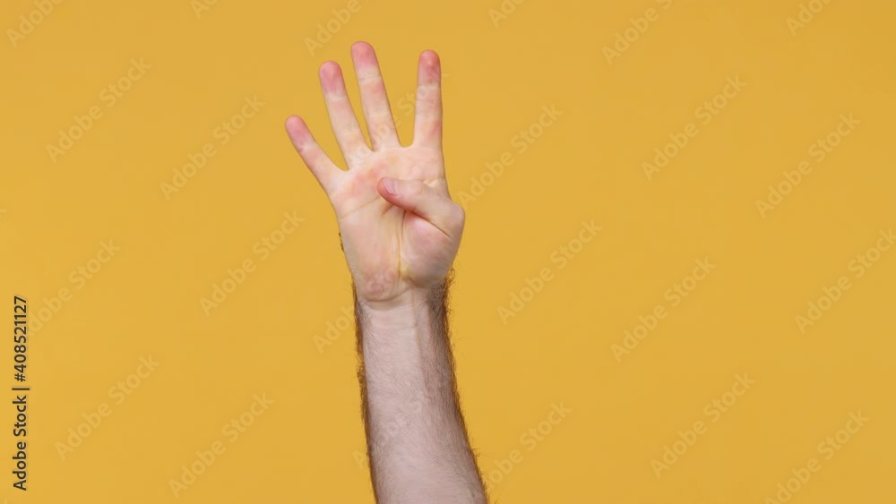 Cropped close up man male hand showing fingers ordinal count from one to five 1 5 gesture isolated on yellow background studio. Copy space commercial promo advertisement. Advertising workspace mock up