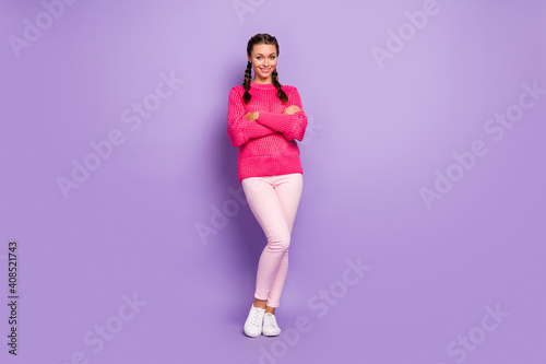 Full length photo of charming happy young woman hold hands crossed good mood isolated on violet color background