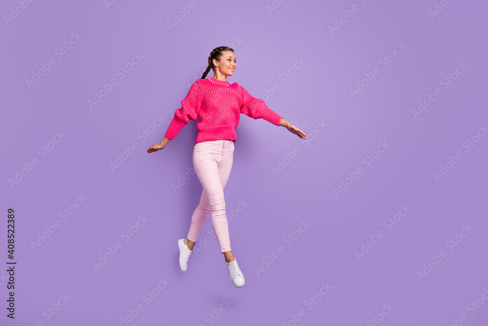 Full size profile side photo of young beautiful attractive smiling cheerful girl jumping go walk isolated on violet color background