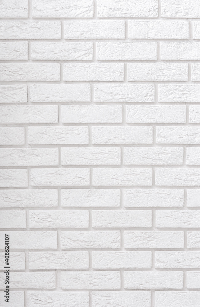 A white brick wall. Copy space for text.Vertical brick background A white brick wall. Copy space for text.Vertical brick background