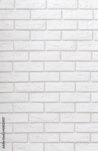A white brick wall. Copy space for text.Vertical brick background