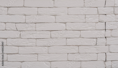 White brick wall with crack.Copy space for text.