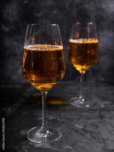 amber or orange wine made from white grapes. in a tall wine glass. Georgian national wine according to old technology