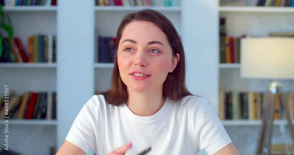 Webcam view of happy woman talking to friends online natural light slow motion. Young cheerful student girl communicating by video call recording vlog. Distant job interview technology Webcam view of happy woman talking to friends online natural light slow motion. Young cheerful student girl communicating by video call recording vlog. Distant job interview technology