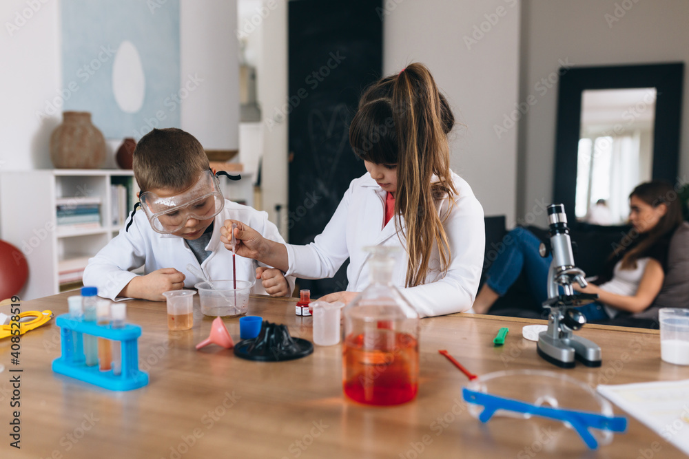 children do chemical experiments from kitchen ingredients at home