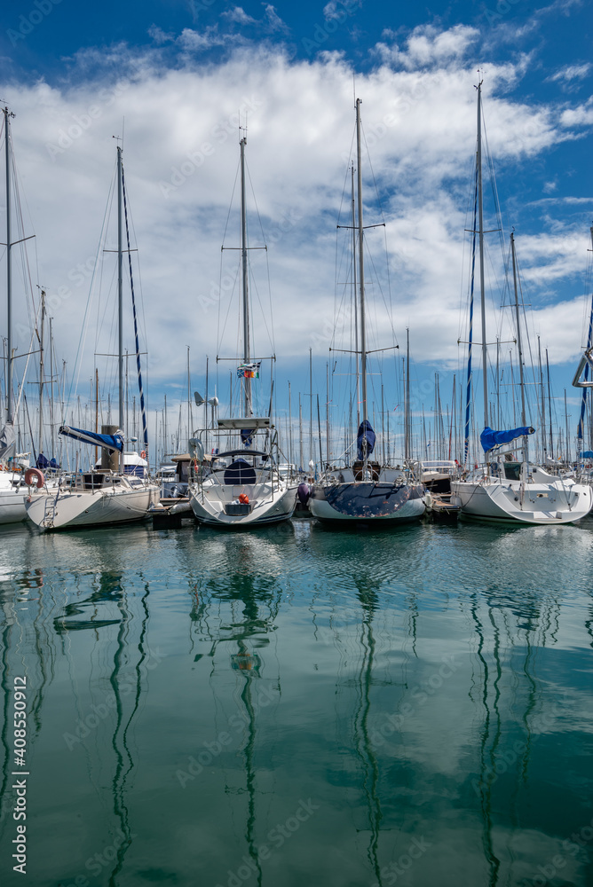 Sailboats reflection at french harbor