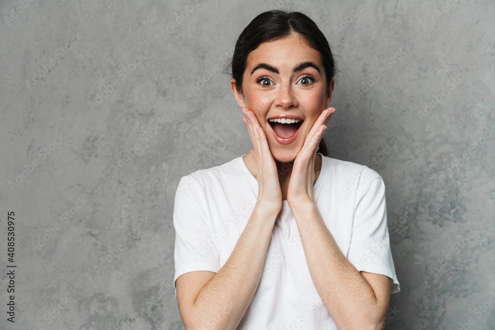 Happy excited beautiful young woman in casual wear Happy excited beautiful young woman in casual wear