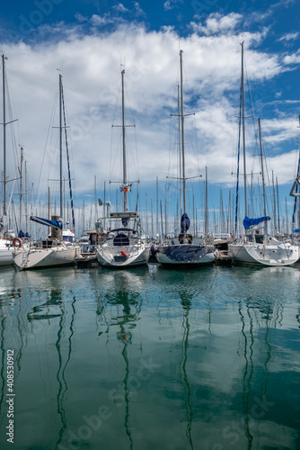 Sailboats reflection at french harbor © Ok More Photos