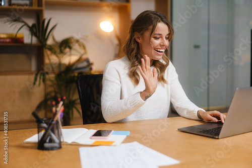 Beautiful young woman manager on a video call