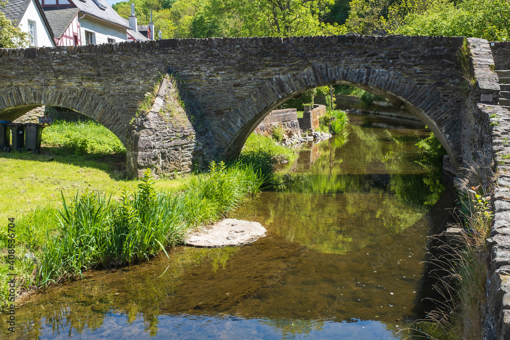 View to a stone bridge in the romantic Eifel town of Monreal / Germany View to a stone bridge in the romantic Eifel town of Monreal / Germany