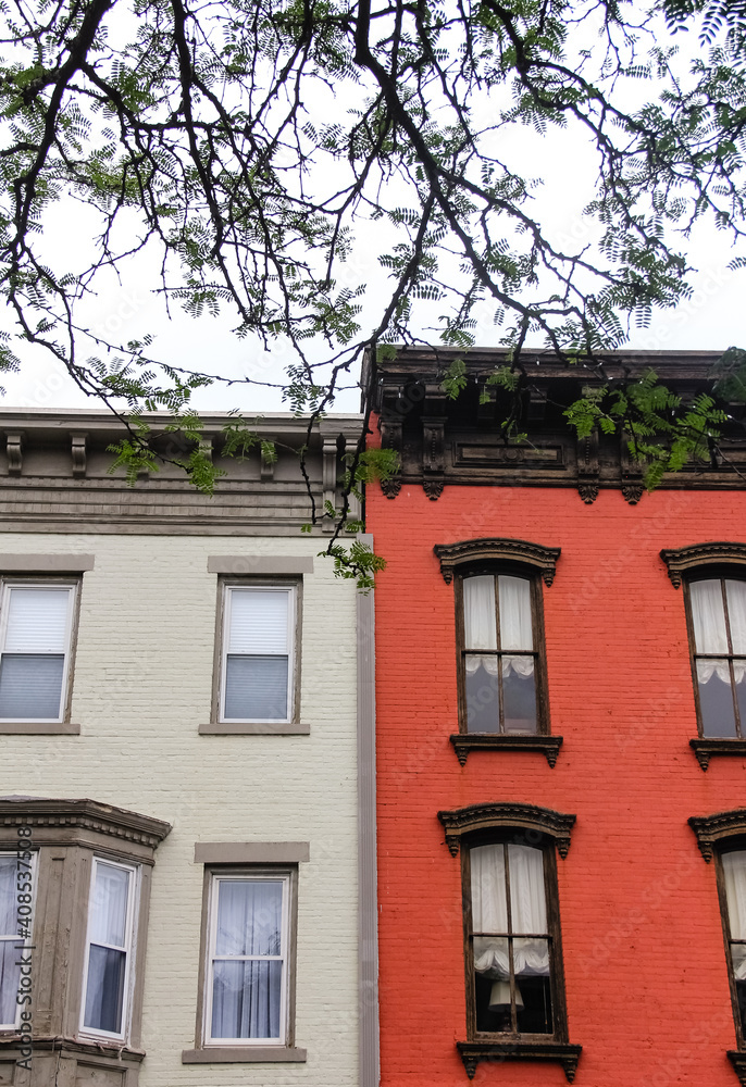 beige white and red row house buildings