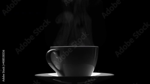 cup of coffee (or tea) with steam on a black background (seamless looping)