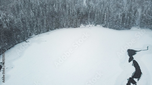 Top view of a frozen pnd near the Feldsee, Black Forest, Germany photo