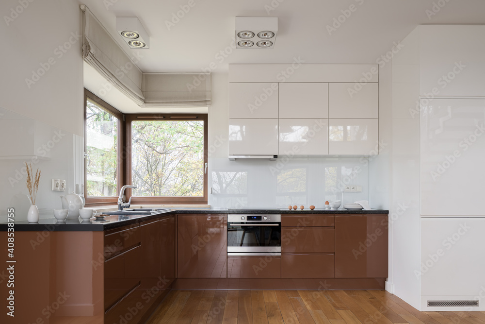 Spacious white and brown kitchen Spacious white and brown kitchen