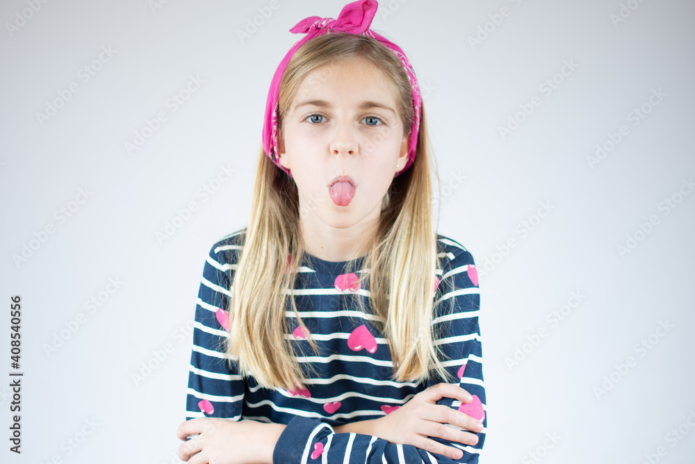 Funny blond girl stick out the tongue over white background. Funny blond girl stick out the tongue over white background.