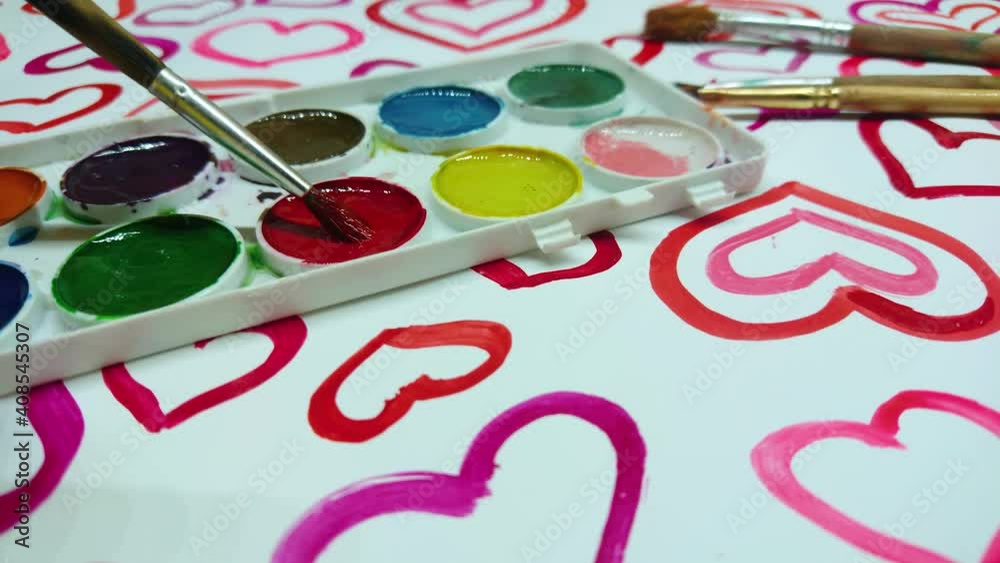 Process of drawing hearts by a brush with a red color Process of drawing hearts by a brush with a red color