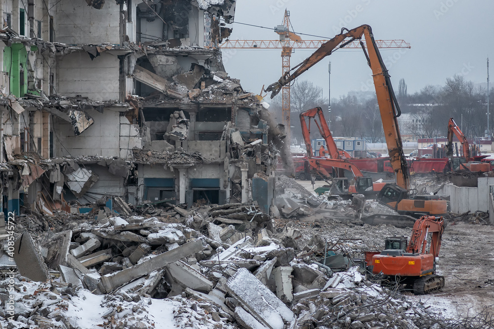 Demolition of an old industrial building in Moscow on a cloudy winter day Demolition of an old industrial building in Moscow on a cloudy winter day