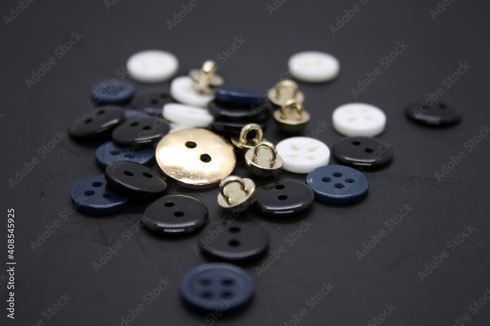 Blue, white and black buttons on black background. Blue, white and black buttons on black background.