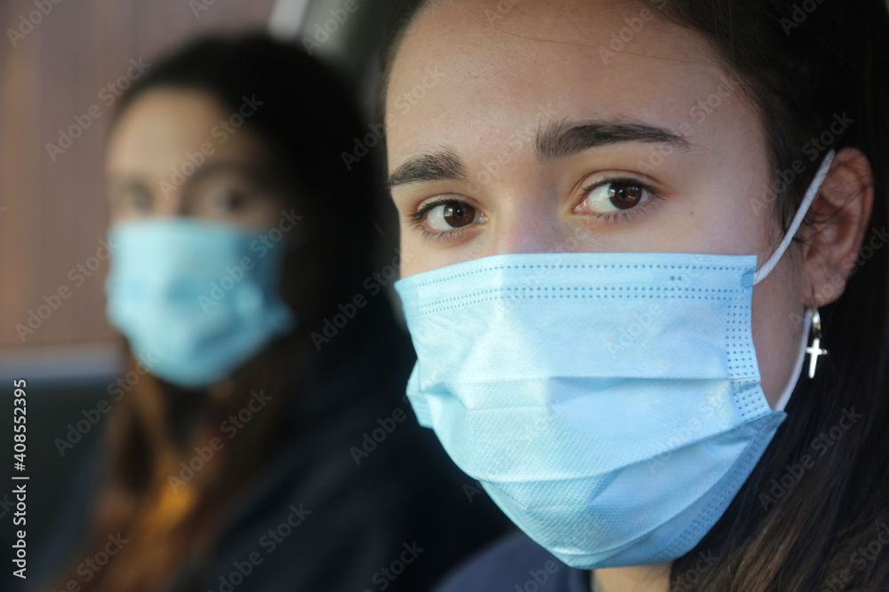 girls with mask as protection against virus