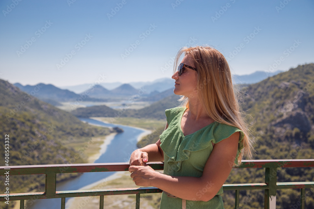 young woman enjoy view of skadar lake, National park of Montenegro.
