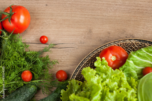 Healthy eating. The concept of healthy food, fresh vegetables on a wooden background. View from above. Copy space.