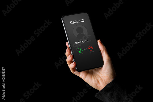 Fototapeta Person receiving call on phone from an unknown caller