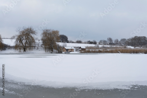 A small fishing lake (Bakonyszücsi Horgásztó) with a boat near, (Bakonyszucs, Hungary)