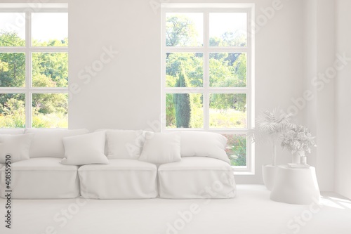 White living room with sofa and summer landscape in window. Scandinavian interior design. 3D illustration