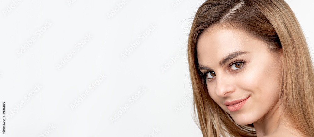 Naklejka premium Face portrait of a beautiful young caucasian woman on a white background with copy space