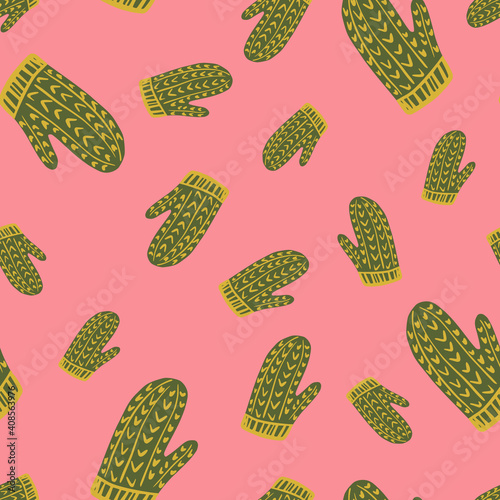 Random abstract christmas accessory seamless pattern with simple mittens shapes. Pink bright background.