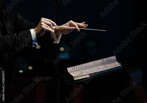 Fotobehang Hands of the conductor of a symphony orchestra closeup