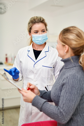 Patient in clinic signs document. Diagnostic and treatment procedures. Introduction medicines requires testing for compatibility. Lack allergic reactions