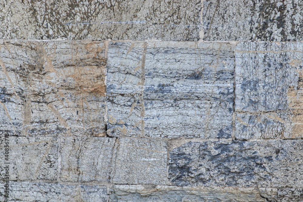 Fototapeta premium Ancient stone wall background closeup.