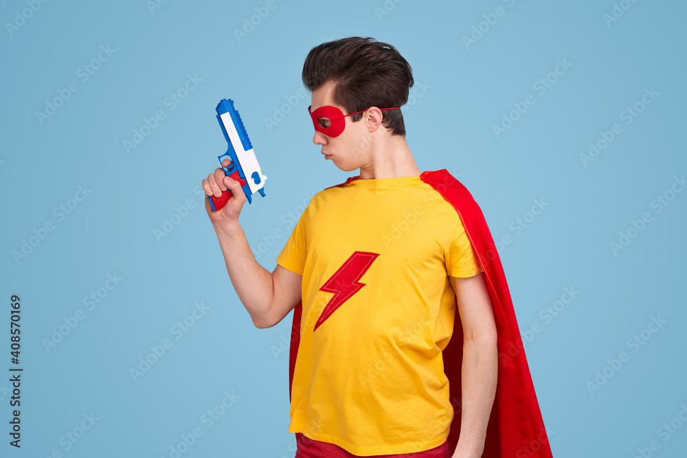 Brave superhero with toy gun