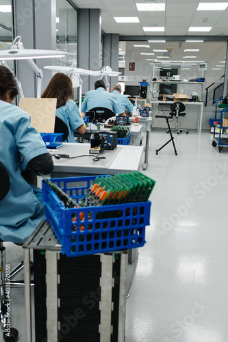 several workers make the products on their work table