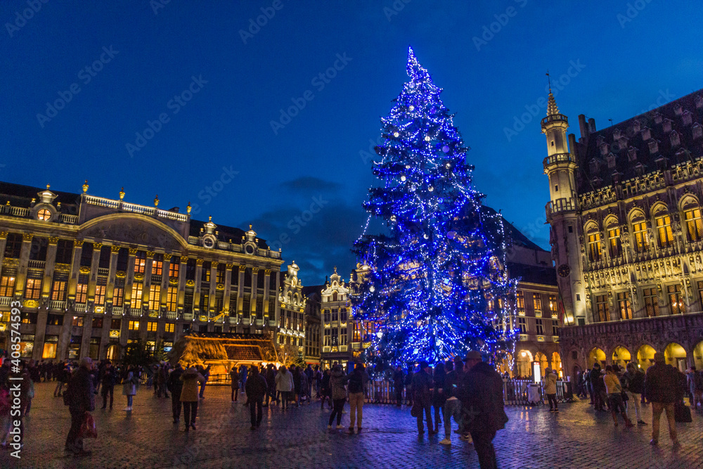 BRUSSELS, BELGIUM - DECEMBER 17, 2018: Evening view of the Grand Place (Grote Markt) with a christmas tree and illuminated buildings in Brussels, capital of Belgium