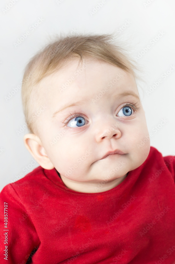 Little child looks with hope with big eyes gray background. Little child looks with hope with big eyes gray background.