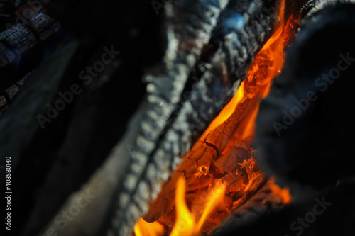 Dry logs burn on fire - low key stock photo