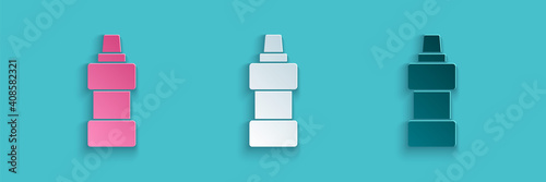 Paper cut Plastic bottle for laundry detergent, bleach, dishwashing liquid or another cleaning agent icon isolated on blue background. Paper art style. Vector.